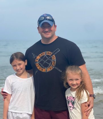 Sergeant Finnerty with his daughters